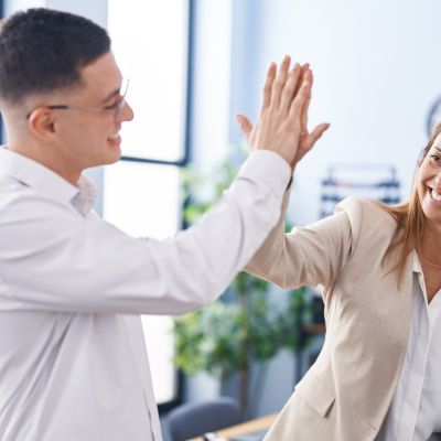 A client and their CPA high fiving.