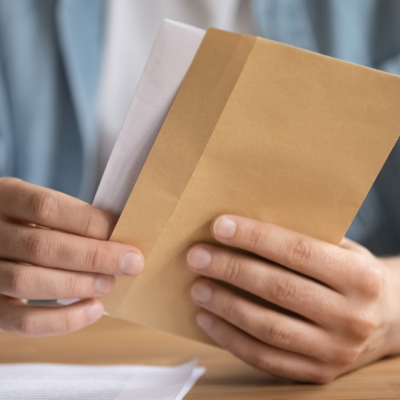 Hands holding an envelope.