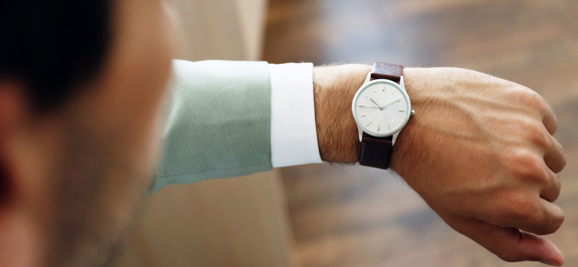 A watch on a man's left wrist